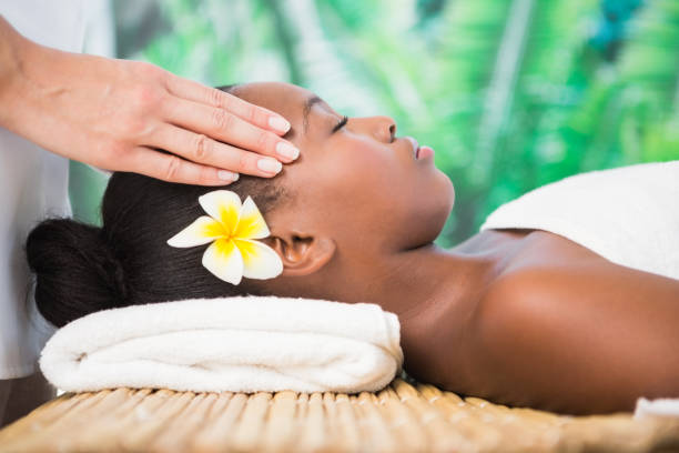 istock Pretty woman enjoying a head massage 800472076
