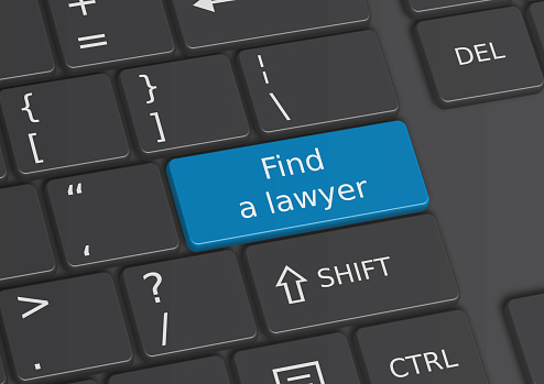 A 3D illustration of the words Find a lawyer written on a blue key from the keyboard