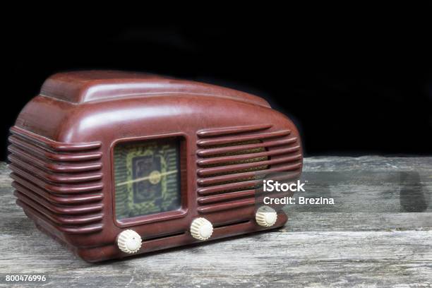 Side View Of Old Radio Standing On The Old Wooden Desk Stock Photo - Download Image Now
