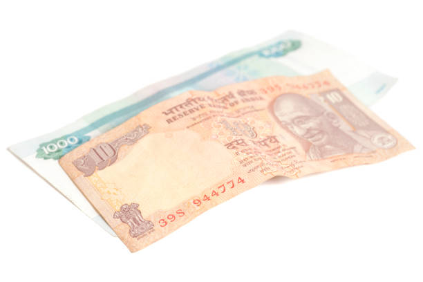istock One thousand russian rubles and ten Indian rupees isolated on white 800485802