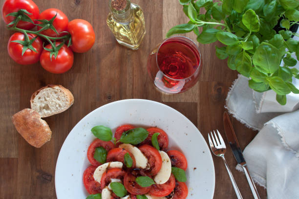 appetizer caprese with a glass red wine - baguette vinegar balsamic vinegar glazed imagens e fotografias de stock