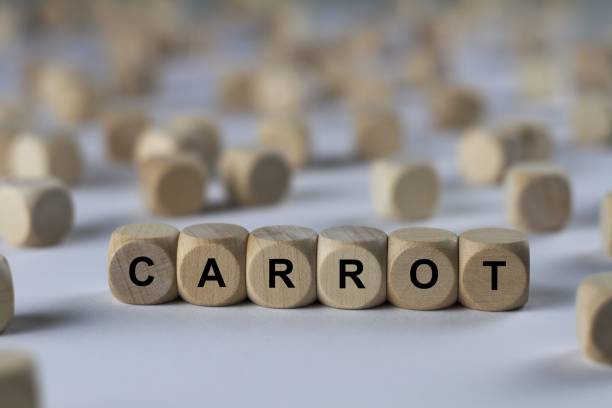 istock carrot - cube with letters, sign with wooden cubes 800492728