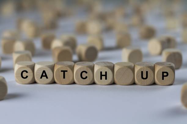 istock catch up - cube with letters, sign with wooden cubes 800492768