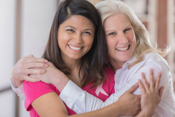 istock Two breast cancer survivors hug and smile for the camera 800493442