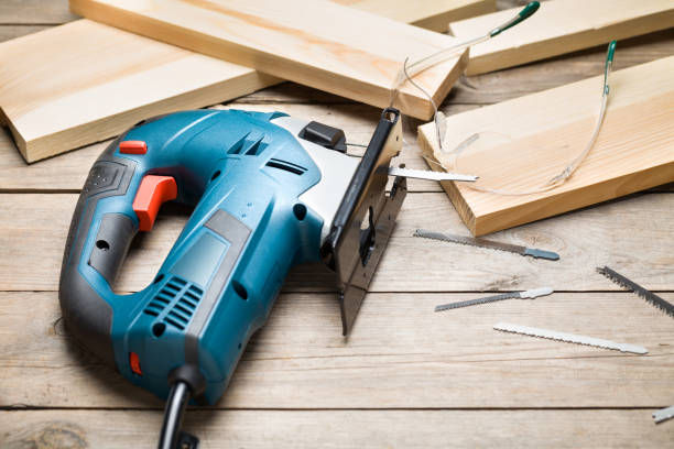 istock Electric jigsaw close up on wooden table 800501498
