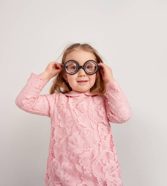 istock Little girl with funny glasses 800501682