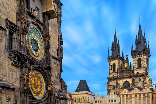 Famous astronomical clock and Church of Our Lady before Tyn on background in Prague, Czech Republic.