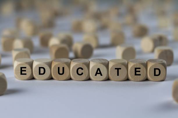 istock educated - cube with letters, sign with wooden cubes 800520570