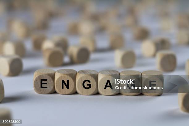 Engage Cube With Letters Sign With Wooden Cubes Stock Photo - Download Image Now - Abstract, Bonding, Book