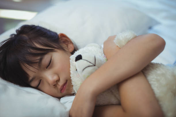 istock Girl sleeping on the bed in bed room 800544742