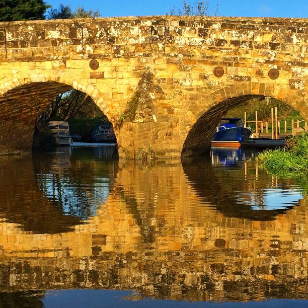istock 2 arches of the Newenden stone bridge 800640808