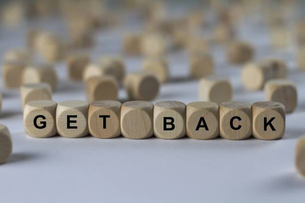 istock get back - cube with letters, sign with wooden cubes 800692444
