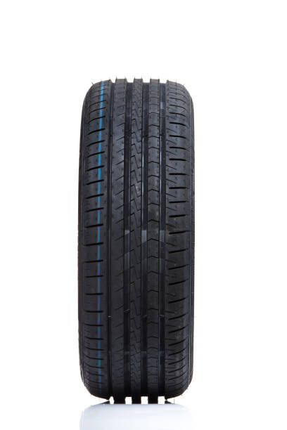 istock Stack of brand new high performance car tires on clean high-key white studio background 800750450