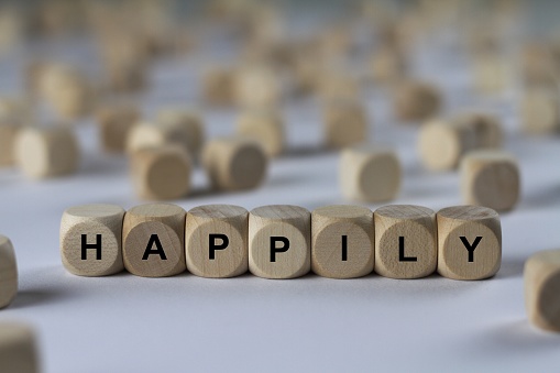 happily - cube with letters, sign with wooden cubes