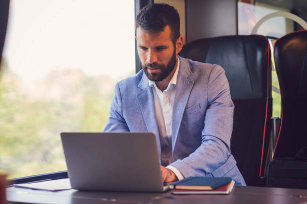 istock Businessman working and traveling by train 800843150