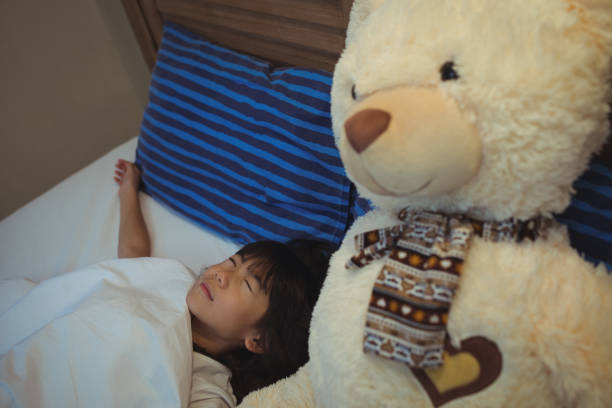 istock Girl sleeping on bed in bedroom 800845354