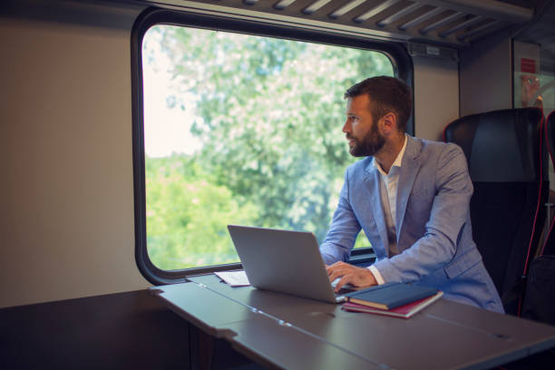 istock Businessman working and traveling by train 800846576