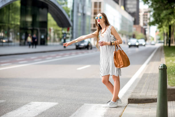 istock Woman cathcing a taxi 800846672