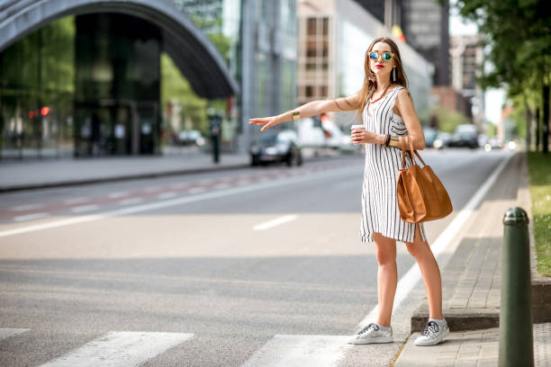 istock Woman cathcing a taxi 800846704