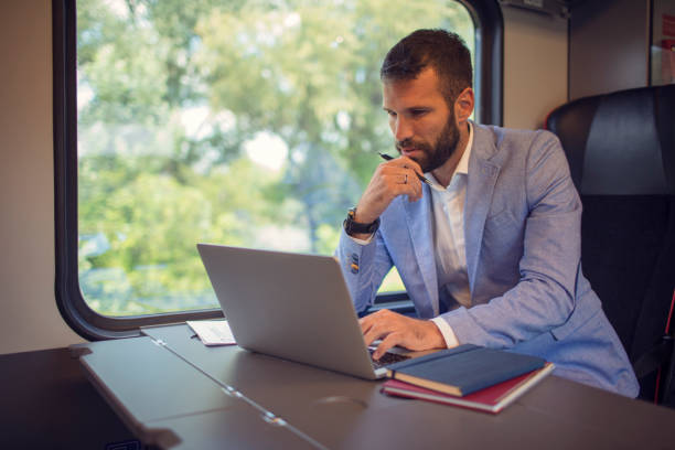 istock Businessman working and traveling by train 800851768
