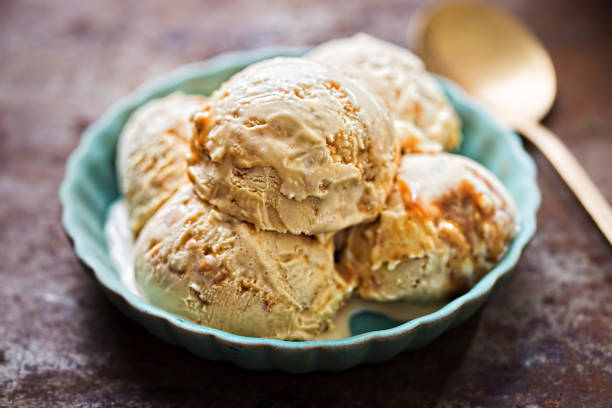 Salted caramel ice creams on blue plate Salted caramel ice creams on blue plate homemade icecream stock pictures, royalty-free photos & images