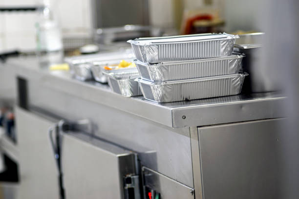 Take away  food in foil boxes in Chinese restaurant kitchen