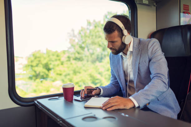 istock Businessman podcasting in the train 800856050