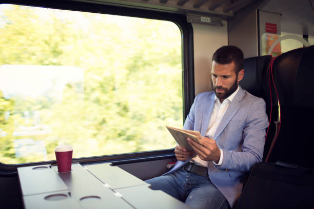 istock Businessman traveling by train 800857998