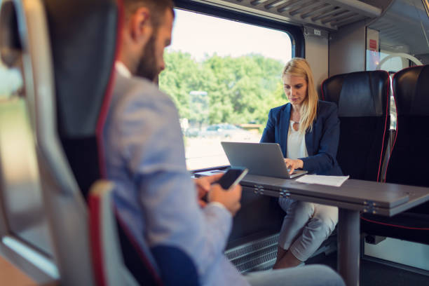Business people working in the train Business people traveling and working in the train commuter train photos stock pictures, royalty-free photos & images