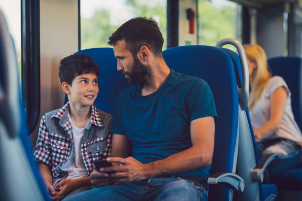 istock Family traveling by train together 800866840