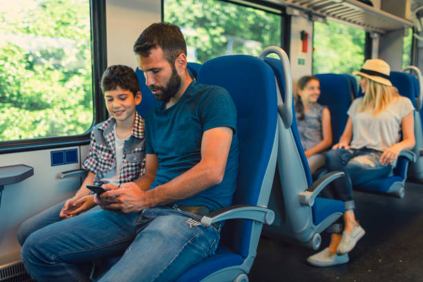 istock Family traveling by train together 800874344