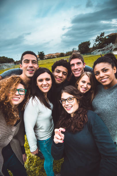 friends take a selfie all together friends take a selfie all together multi ethnic group college student group of people global communications stock pictures, royalty-free photos & images