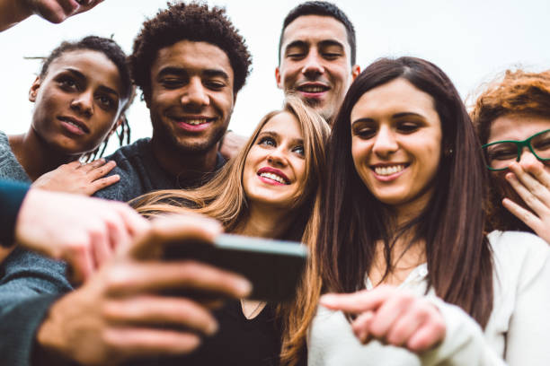 istock friends take a selfie all together 800874612
