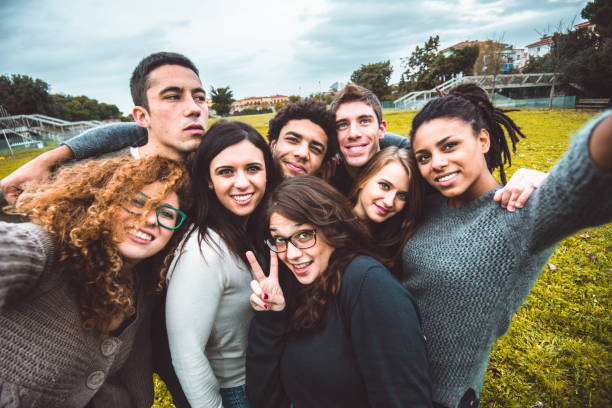 istock friends take a selfie all together 800874674