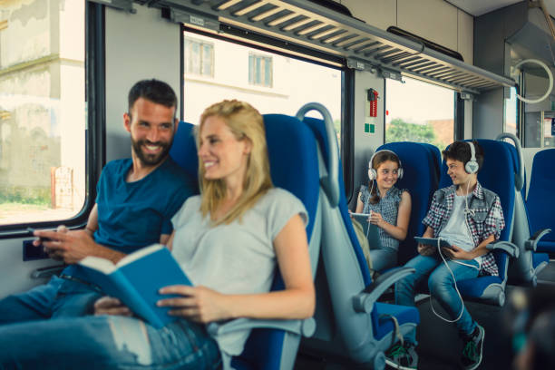 istock Family traveling by train together 800874774
