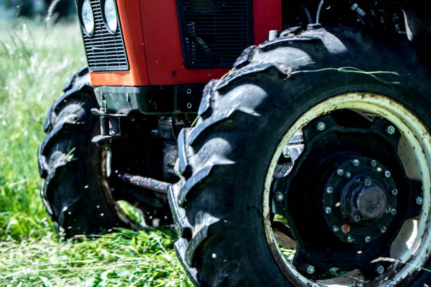 istock A part of tractor on the grass 800883660