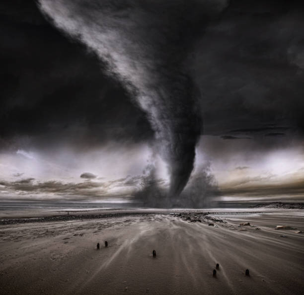 un tornado che attraversa una spiaggia deserta - tornado storm disaster storm cloud foto e immagini stock