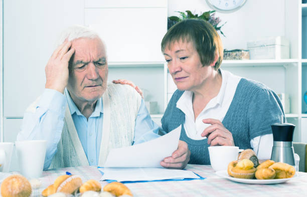 istock Aged couple struggling to pay bills 800967240