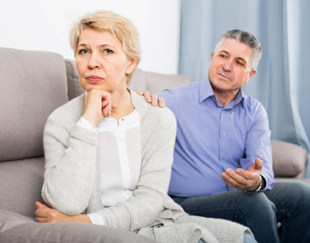istock middle-aged couple quarreling at home with each other 800967320
