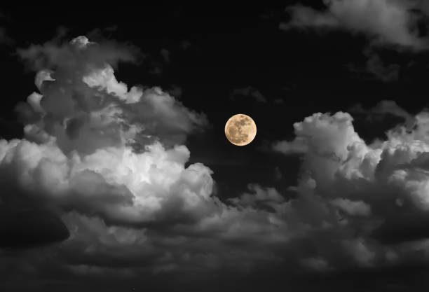 istock blur moon on black and white sky with cloud 800992922