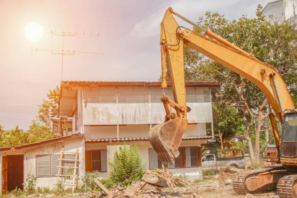 istock bucket  excavator destruction in work outdoor construction  with sunset light tone 800998072
