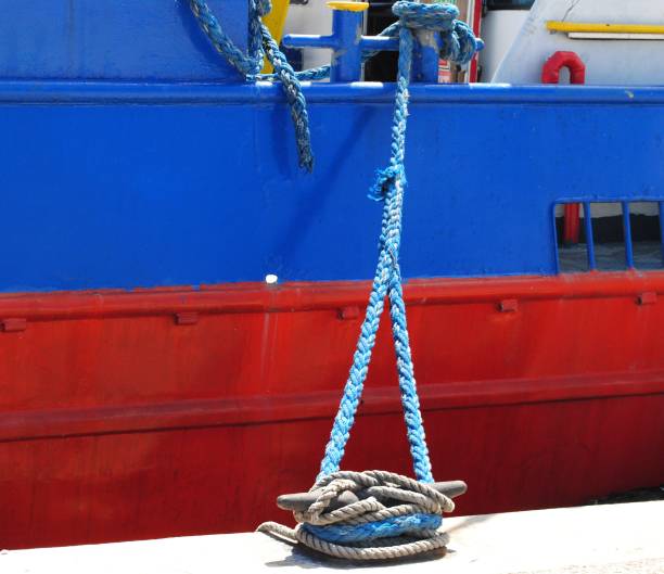 istock Braids of blue and gray ropes at the harbor 801016546
