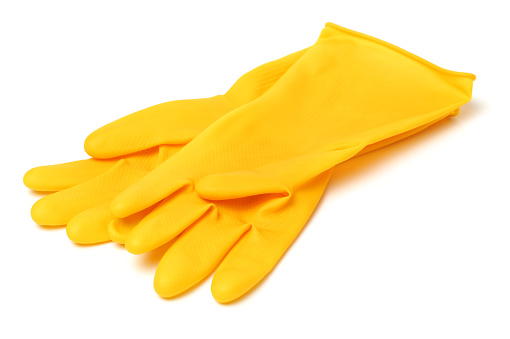 Yellow rubber gloves on white background
