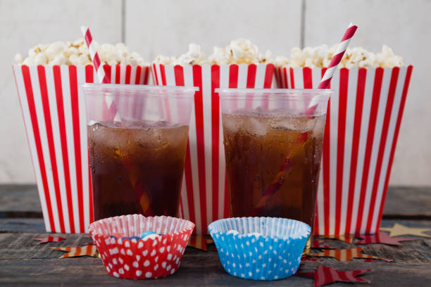 Tokyo, Japan -August 10, 2024: Colorful popcorns in a glass on black background
