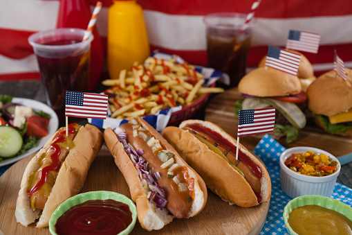 Drink and snacks on wooden table with 4th july theme