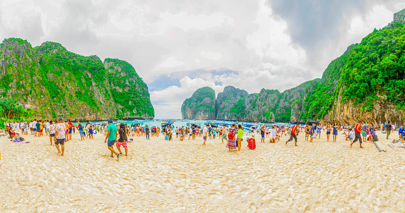 Ko Phi Phi, Thailand - June 24, 2017: People visit Ko Phi Phi island in Thailand. Around 26.7 million people visite Thailand per year.