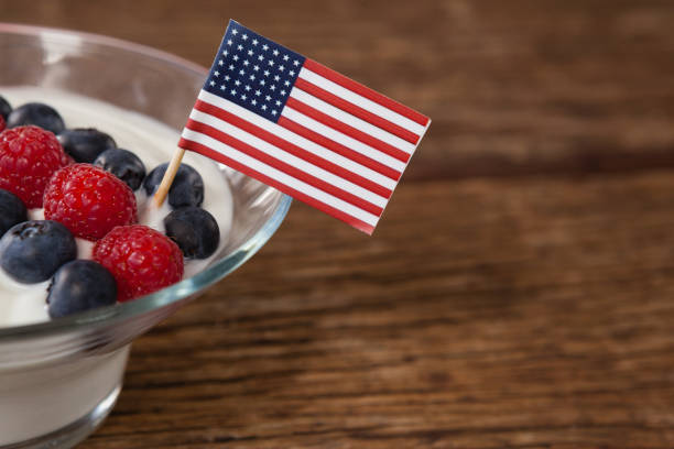 Close-up of fruit ice cream decorated with 4th july theme Close-up of fruit ice cream decorated with 4th july theme on wooden table 70s theme stock pictures, royalty-free photos & images