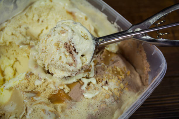 istock Spoon with a ball of ice cream. Close-up 801033372