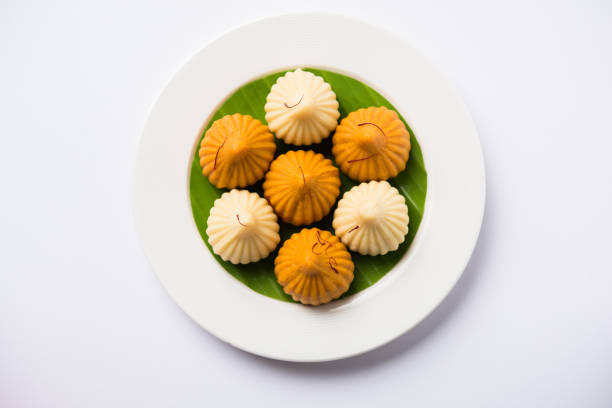 A modak is an Indian sweet dumpling popular in India. It is called modak, Kozhakkatta, modhaka, kadubu, modhakam, kozhakkattai, kudumu. made up of coconut and jaggery, rice flour, wheat with khava