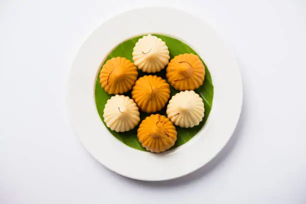 A modak is an Indian sweet dumpling popular in India. It is called modak, Kozhakkatta, modhaka, kadubu, modhakam, kozhakkattai, kudumu. made up of coconut and jaggery, rice flour, wheat with khava